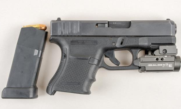 Loaded handgun recovered from stolen vehicle, four charged